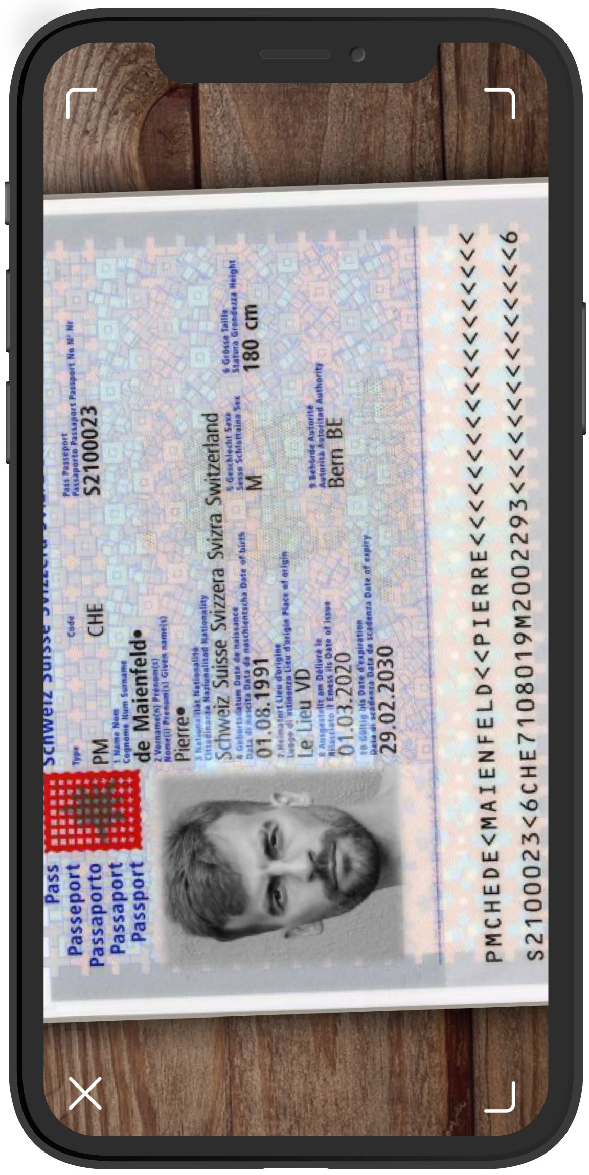 1. Open your passport. Hold the camera of your mobile phone over your passport in such a way that it can scan all of the page’s content.